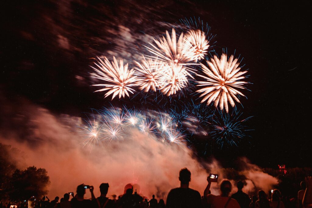 People Watching Fireworks Display During Nighttime in December